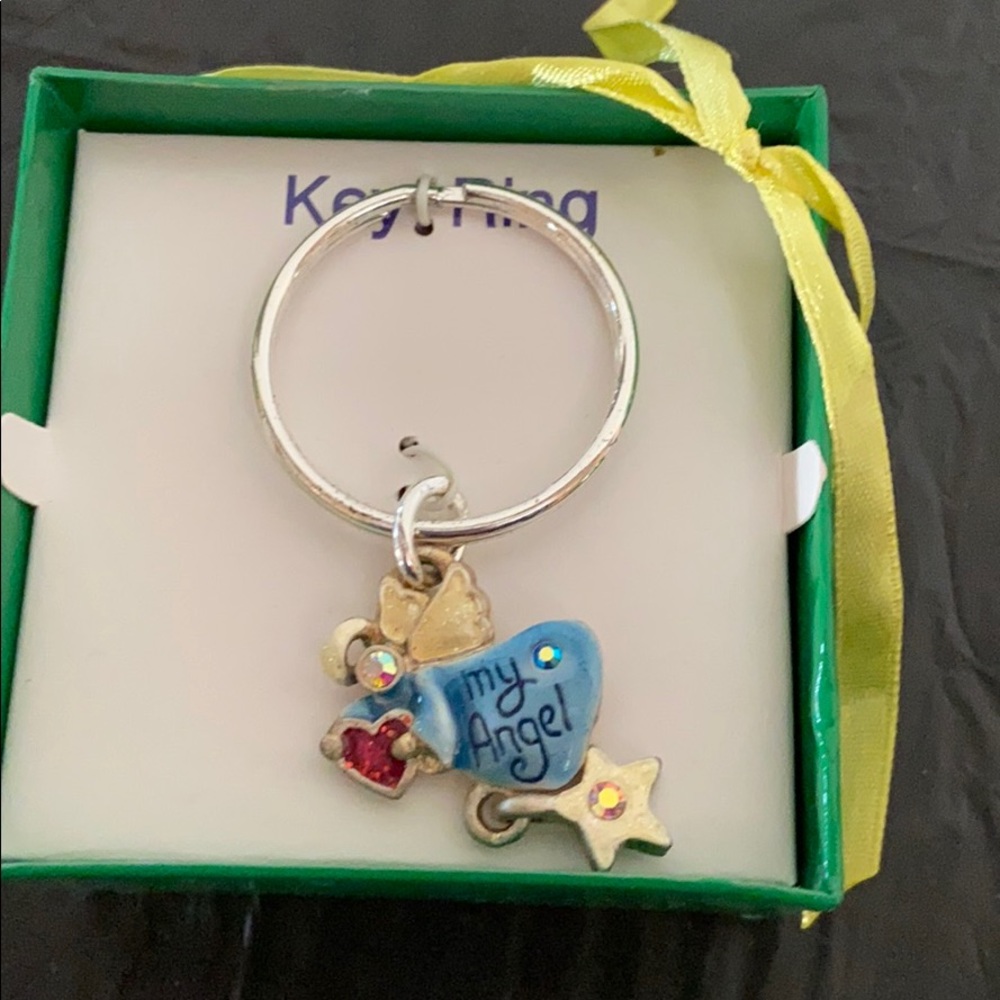 Key Chain that features dangling angel